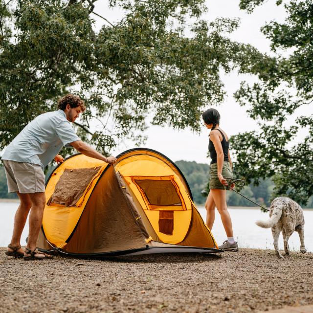 Couple camping with a dog at Petit Jean State Park